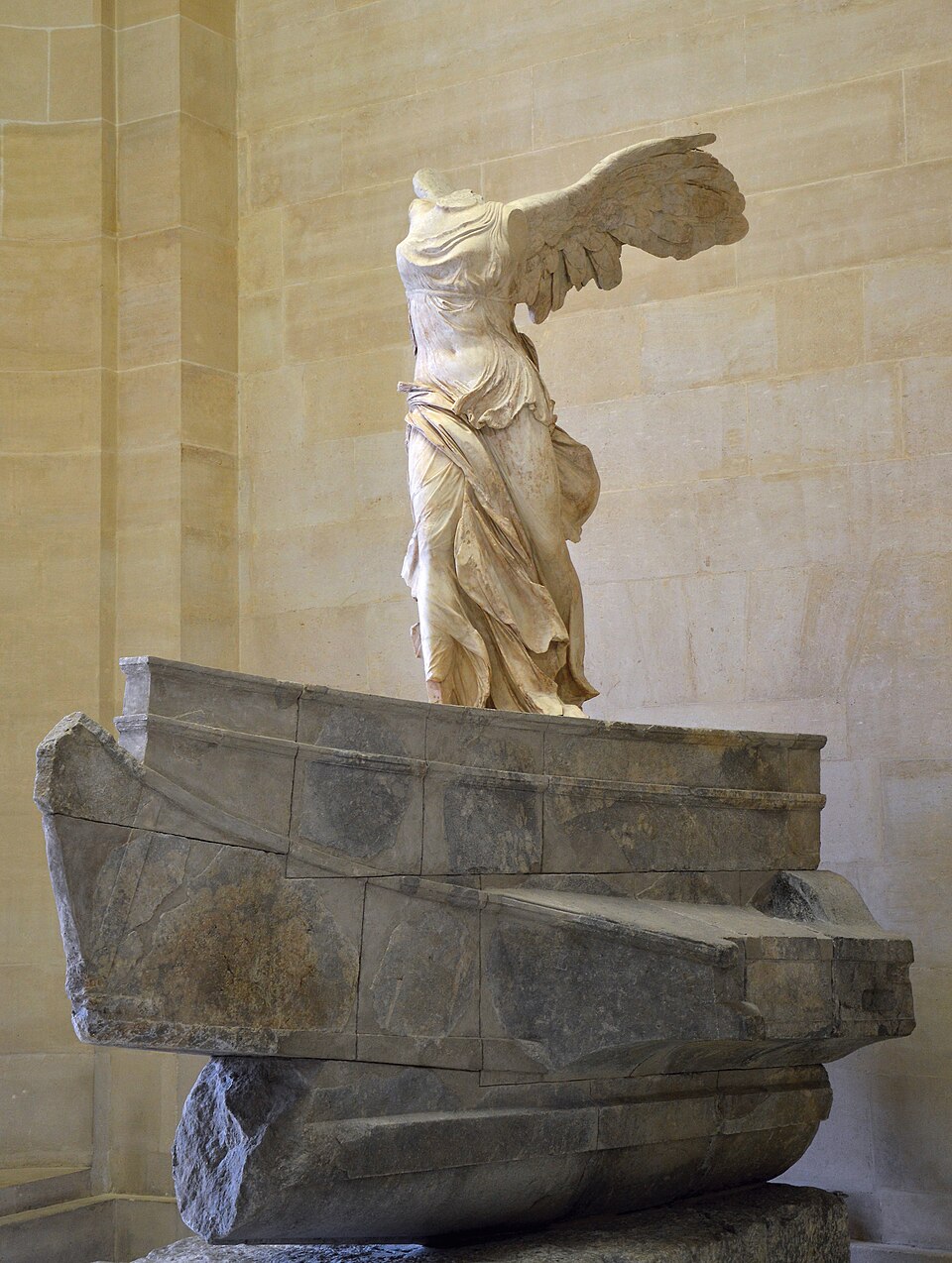 A photograph of the headless winged marble figure of the Winged Victory of Samothrace.
