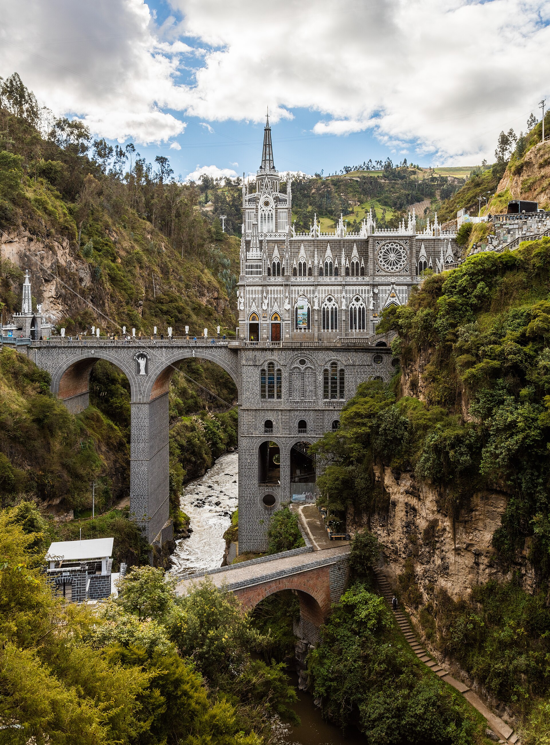 Las Lajas Shrine rising above a gorge, with an arched bridge leading to the church.
