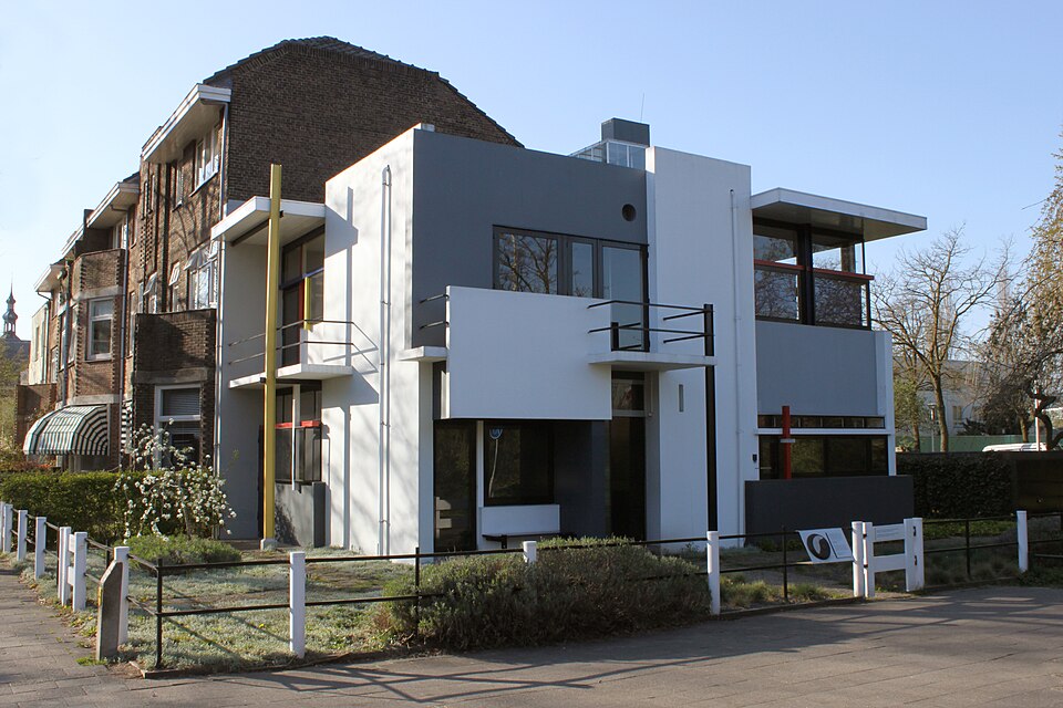 Rietveld Schröder House with projecting horizontal planes and coloured structural accents.
