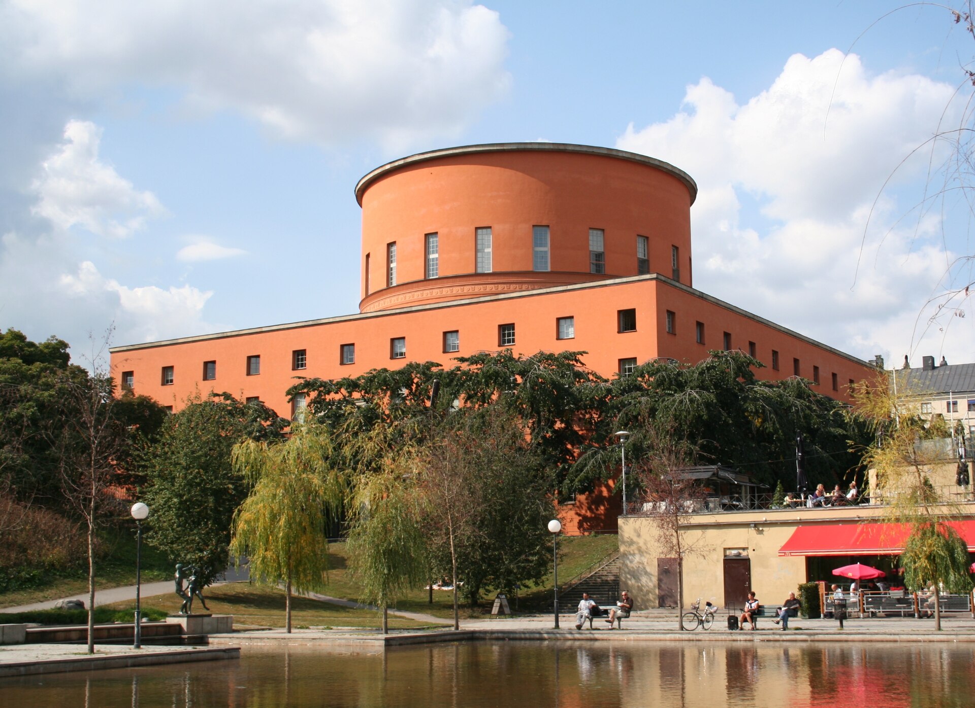 Stockholm Public Library’s cylindrical orange upper volume above its rectangular base.