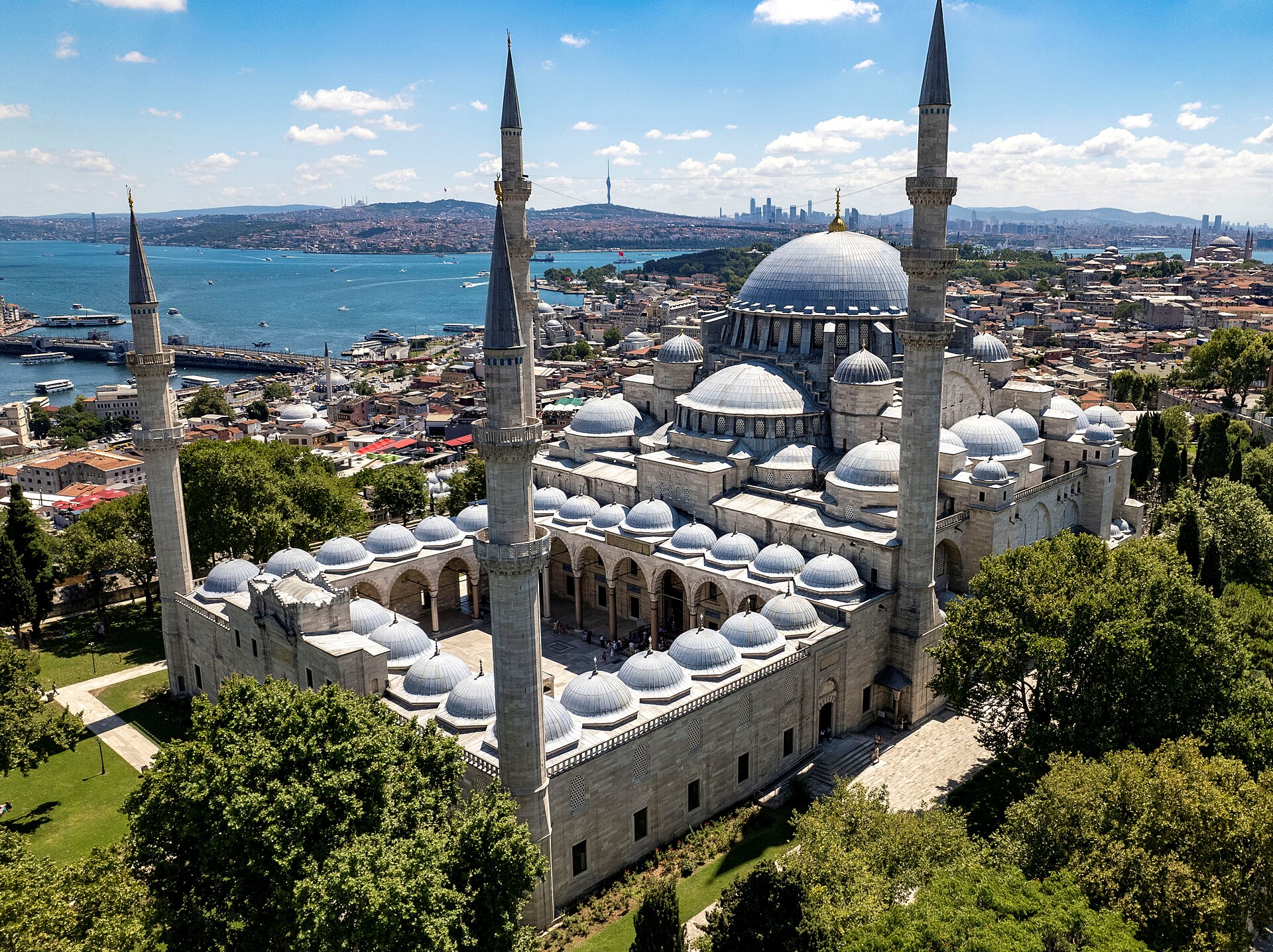 Süleymaniye Mosque domes and minarets with the city and water beyond.